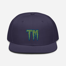 Load image into Gallery viewer, TM Snapback Hat ( Green Letters & Blue Outline )