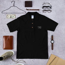 Load image into Gallery viewer, TMB Embroidered Polo Shirt ( Black Letters &amp; White Outline )
