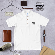 Load image into Gallery viewer, TM Embroidered Polo Shirt ( Black Letters &amp; White Outline )
