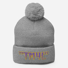 Load image into Gallery viewer, TM4L Pom-Pom Beanie ( Purple Letters &amp; Yellow Outline )
